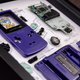 A photo of a disassembled Game Boy Color artfully framed by Grid Studio.